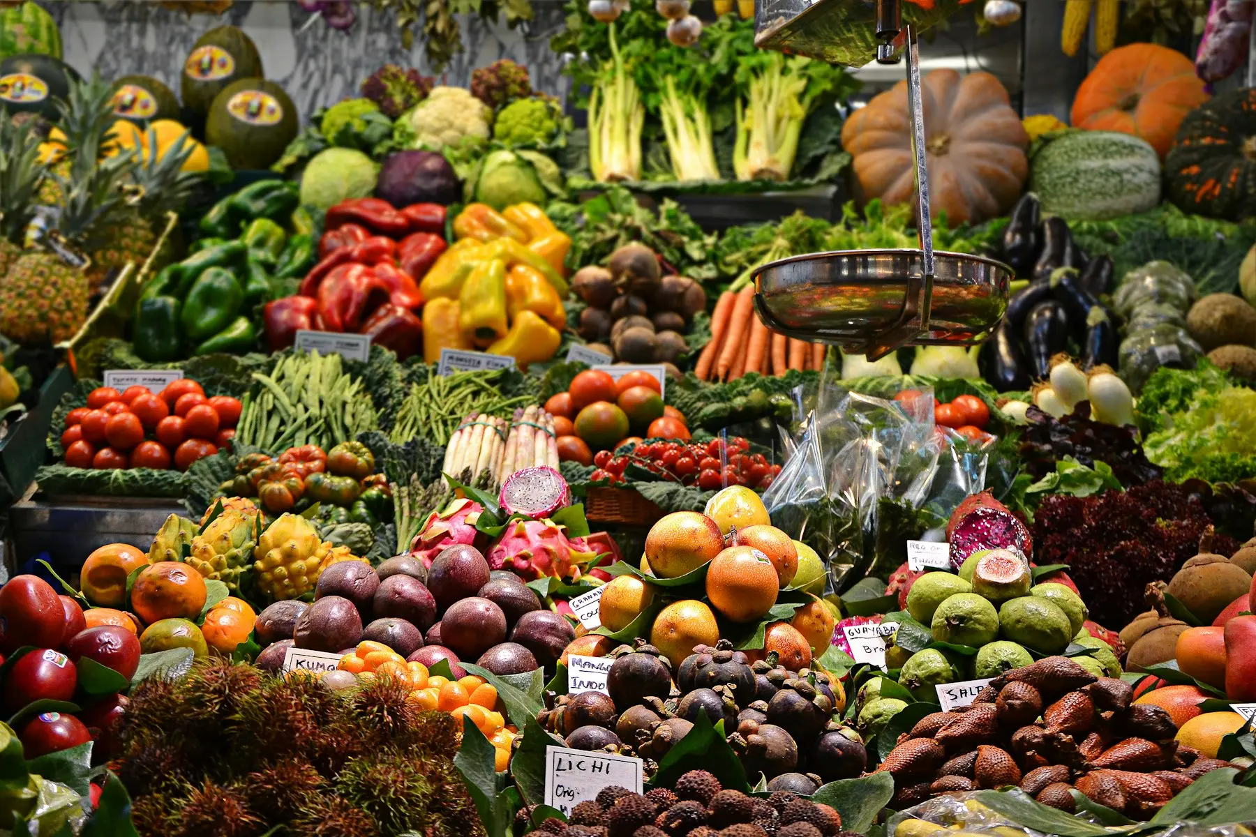 Colourful market stall of fresh fruit and vegetables, used as visual inspiration rather than a photograph of MANSI TP LTD stock